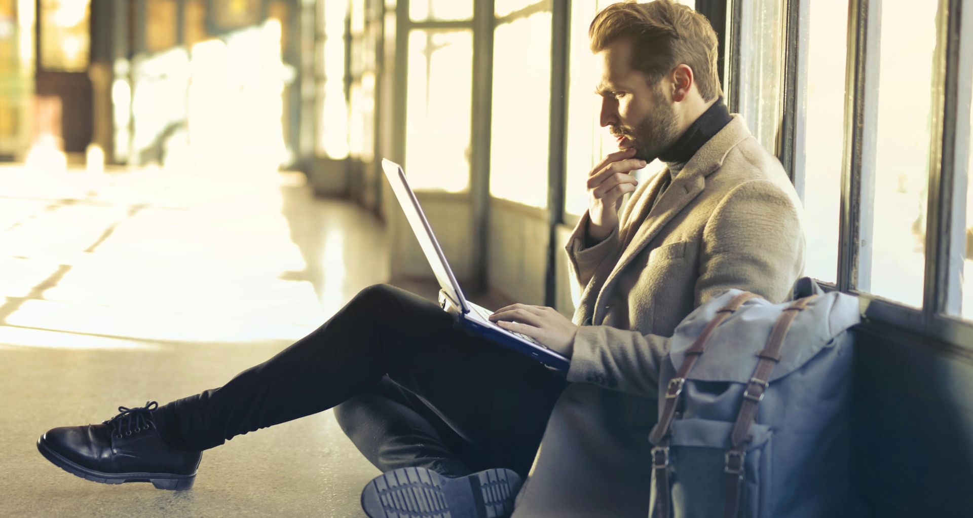 Brown Haired Man Using Laptop Computer